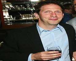 Tim Blake Nelson consuming alcohol